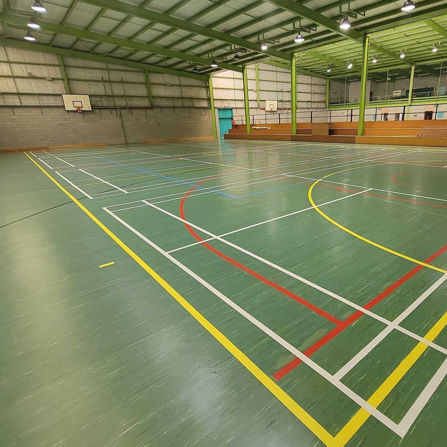 After: glossy green sports court floor with bright line markings